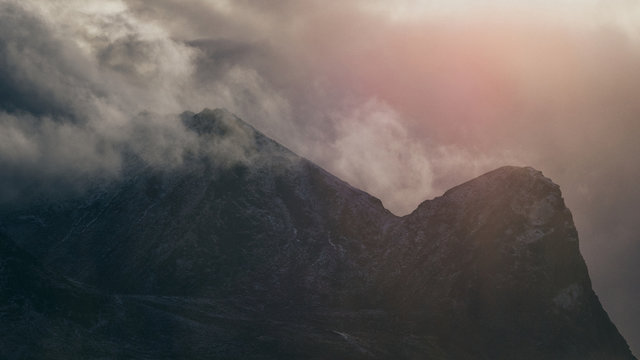 Sunset and clouds over mountains - Powered by Adobe
