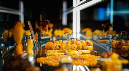 Amber necklace on the glass shelf