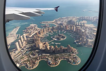 Foto op Canvas The Skyline of Doha from the window of an airplane © hecke71
