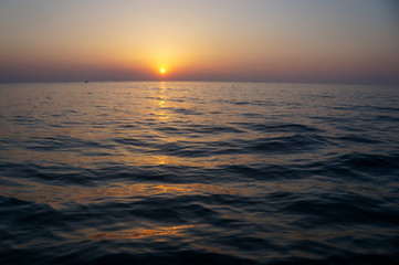 Fototapeta premium beautiful sunrise and ship on sea 