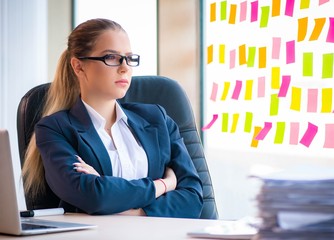 Beautiful female employee with many conflicting priorities