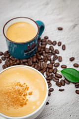 Coffee and coffee beans on white background