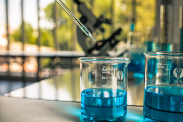 Laboratory Tube With sampling of Virus corona covid 19 vaccine. 
Scientific Lab equipment Close-Up. Concept of Pandemic Disease and Healthcare Vaccine.