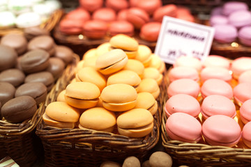 french macarons on counter of market