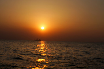 beautiful sunrise and ship on sea 