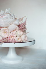 Decorated with fresh flowers, white naked cake, a stylish cake for weddings, birthdays and events.