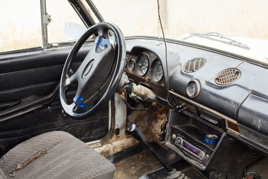 The Very Damaged Interior Of An Old Car From The 1980s