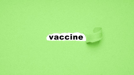 peel away paper to discover vaccine - abstract concept for medical research