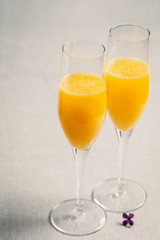 Two glasses of mimosa cocktail