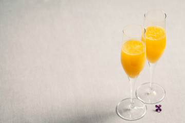 Two glasses of mimosa cocktail