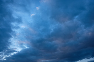 Naklejka na ściany i meble Dark blue clouds in the sky