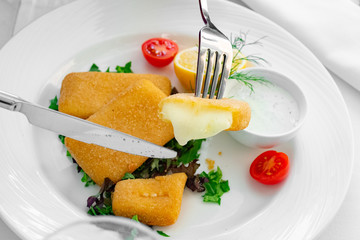 Mozarella sticks cut in half