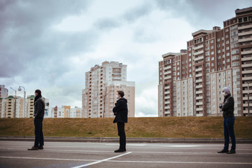 group of people standing in line at a safe distance