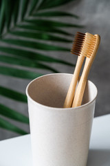 Natural organic bamboo toothbrushes in holder. Zero waste, plastic free, eco friendly equipment for oral personal hygiene.
