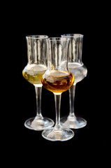 Three glasses of spirits vodka cognac and brandy