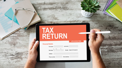 Online tax return application on screen. Business and finance concept.