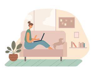 Female freelancer using laptop on couch near dog
