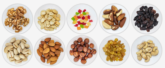 Panorama of calves with various nuts and dried fruits. Hazelnuts, peanuts, cashews, Brazil nut, almonds, pistachios. Isolated background. View from above.