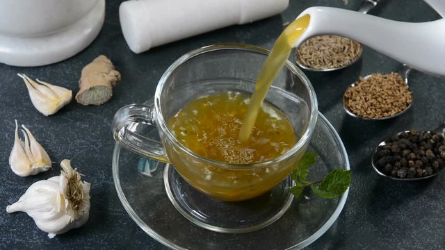 Homemade herbal drink prepared with spices like ginger, peppercorn, cumin and garlic. Herbal drink build good immunity power to fight against common cold, cough and flu.
