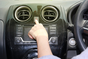 hand with car steering wheel