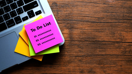 To Do List message concept written post it on laptop keyboard.