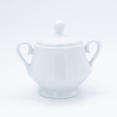 White teapot on white background, over light
