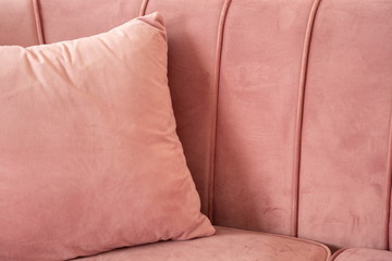 pink pillow on comfort velvet sofa with many space.
