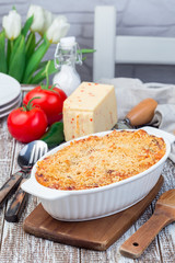Mac and cheese with mini penne pasta, in baking dish, vertical