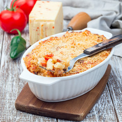 Mac and cheese with mini penne pasta, in baking dish, square format
