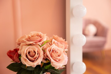 pink rose decoration on makeup table in sweet minimal pastel room .