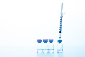 medical drug vial and syringe on wWhite background