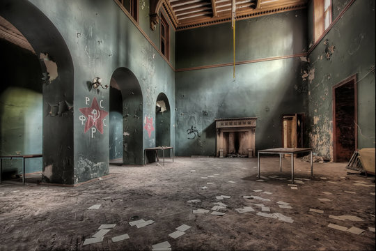 Old room with fireplace in an abandoned building
