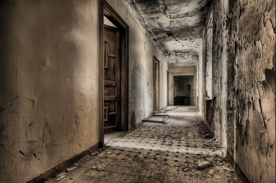 Corridor with ancient doors in an abandoned house
