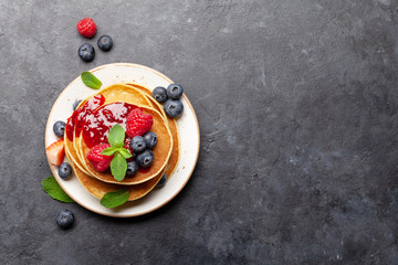 Delicious homemade pancakes with summer berries © evgeeenius