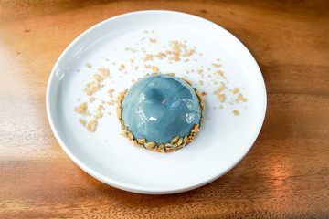 Earl Grey Mousse Cake in white plate.