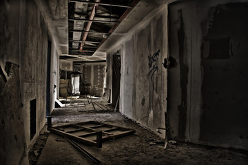 Fototapeta na wymiar Deserted corridor in an abandoned high-rise building