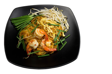 Fried noodle with prawns(Pud Thai) in black dish isolated on white background
