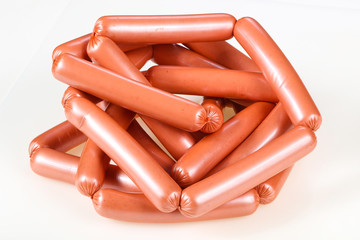 Tasty meat sausages over white background