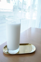 milk shake in tall glasses on the table.