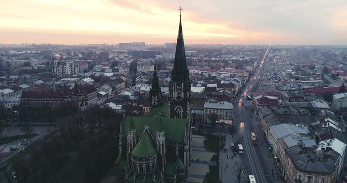 Aerial view of old church and buildings in the old city of Lviv, Ukraine. Flying over of Saint Olga and Elizaveta Church at susnet.