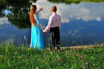 A couple in love by the pond