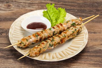 Minced pork skewer kebab with sauce