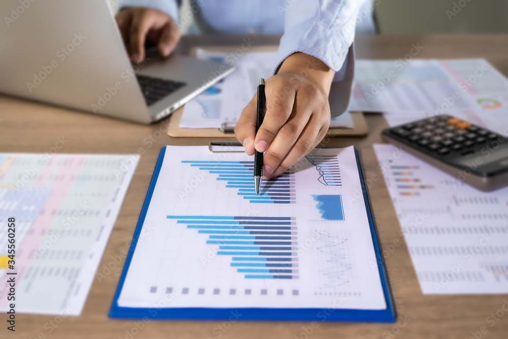 Poster man usingcalculator with money stack financial report- business accounting concept accounting money 