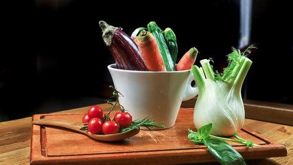 rustic composition of vegetables with black background