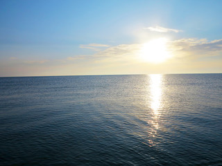 coast of the sea against the background of the sunset 