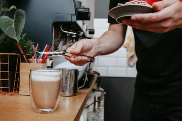 Fototapeta na wymiar Coffee shop operation. The process of preparing drinks.