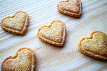 heart-shaped cookies, cutout cookies, heart shaped cookie, valentines desserts, shortbread biscuits, valentine's day cookies, valentines cookies, wooden board