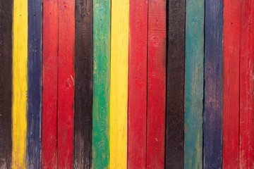 background of multi colored rough boards, red, black, yellow, blue, green