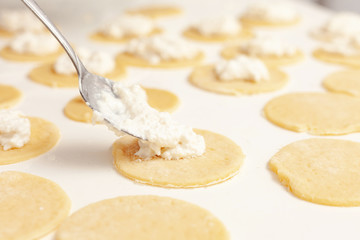 The process of making cookies. A man cooks in the kitchen. Modern lifestyle in home.