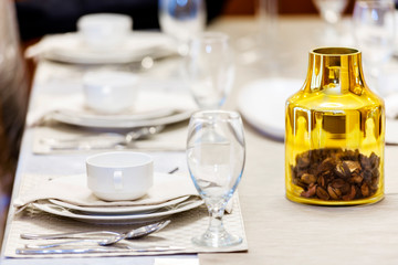 Set of the napkin on plate with mug and glasses